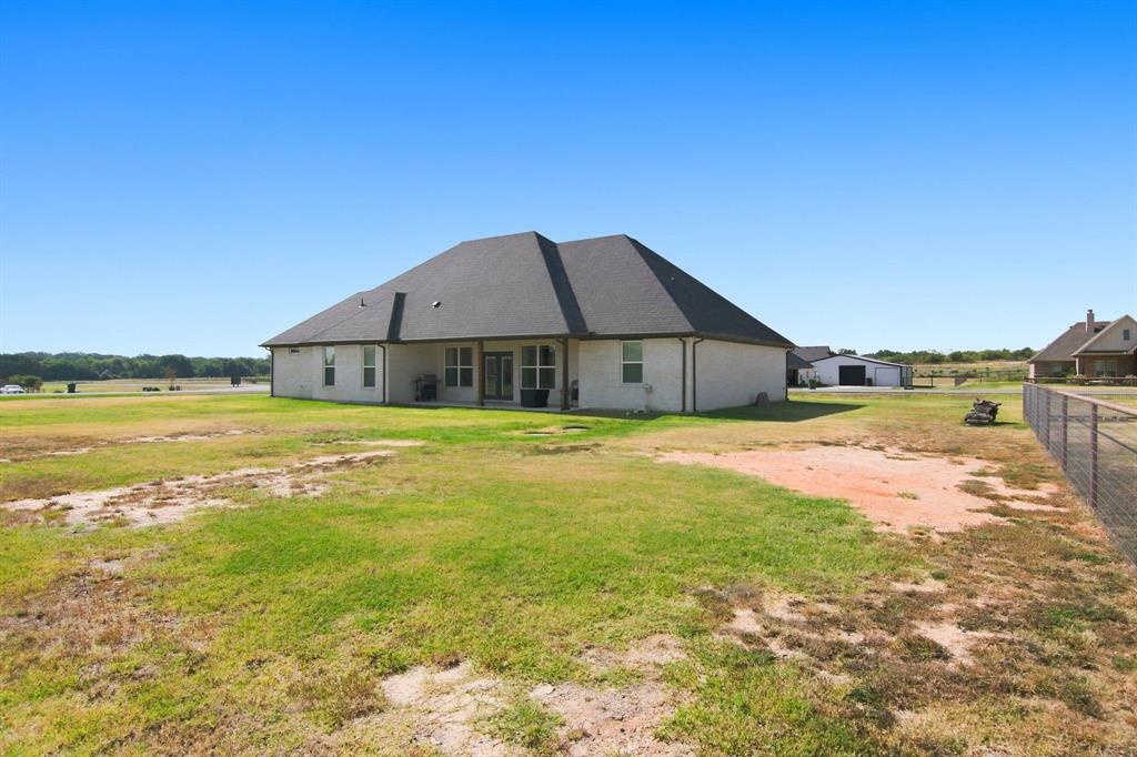 121 Friendship Way Boyd, TX 76023 - Photo 35 of 38 Expansive rear yard with a perimeter fence