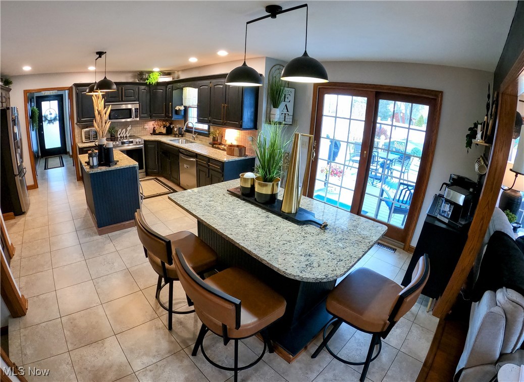 2421 McCoy Road Wooster, OH 44691 - Photo 9 of 39 Dining space with light tile patterned floors and recessed lighting
