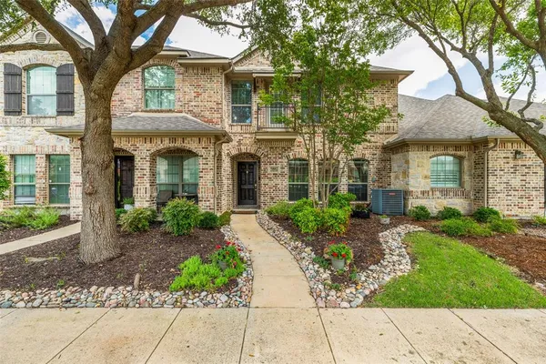 front view of a house with a small yard