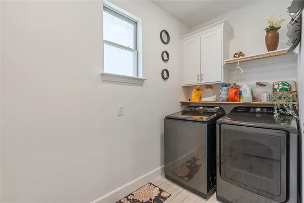 a utility room with dryer and washer