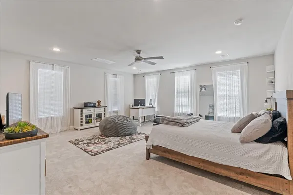 a bedroom with furniture and a bed