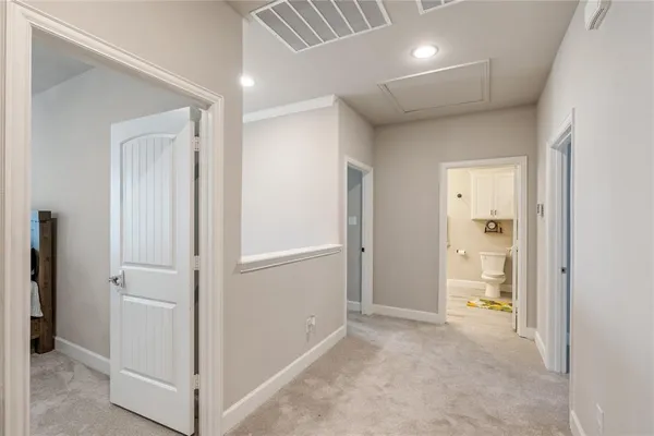 a view of a hallway with an empty room