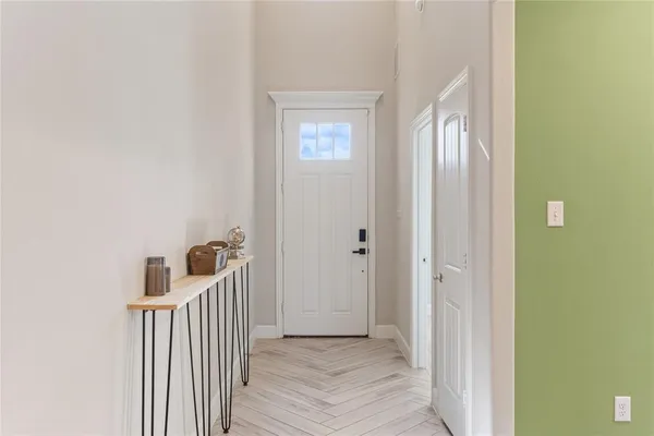 a view of a hallway and a hallway with wooden floor