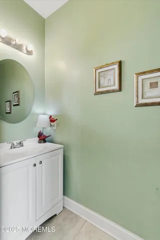 a room with a sink and cabinets
