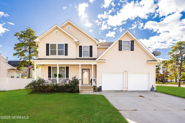 a view of a yard in front view of a house