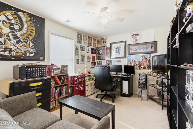 a view of a workspace with furniture and a livingroom