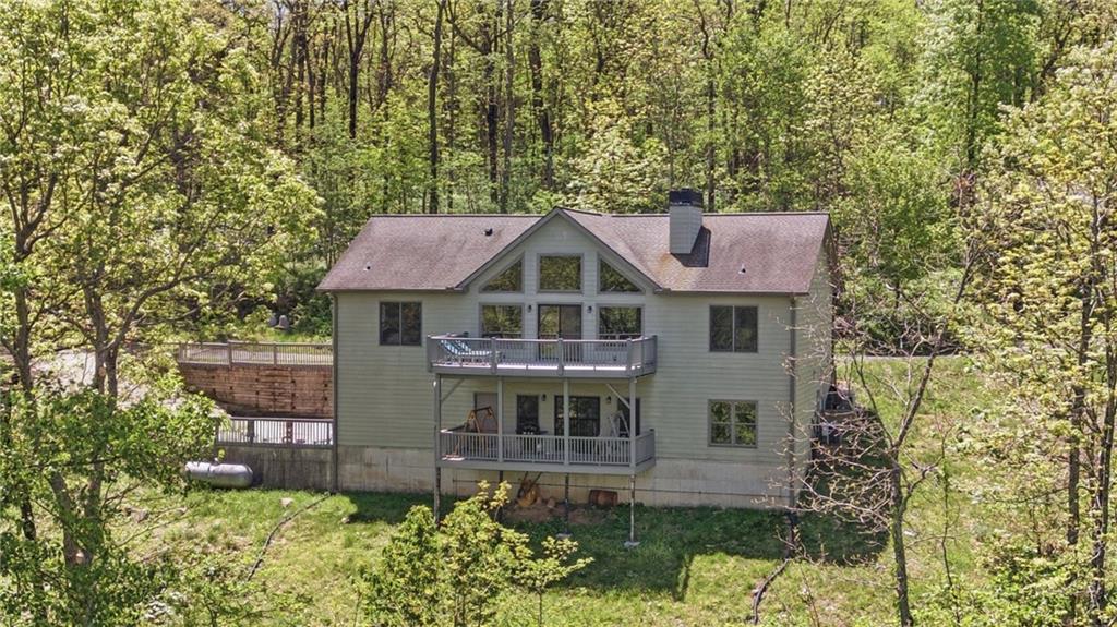 3326 Monument Road Jasper, GA 30143 - Photo 2 of 49 a aerial view of a house with a yard and plants