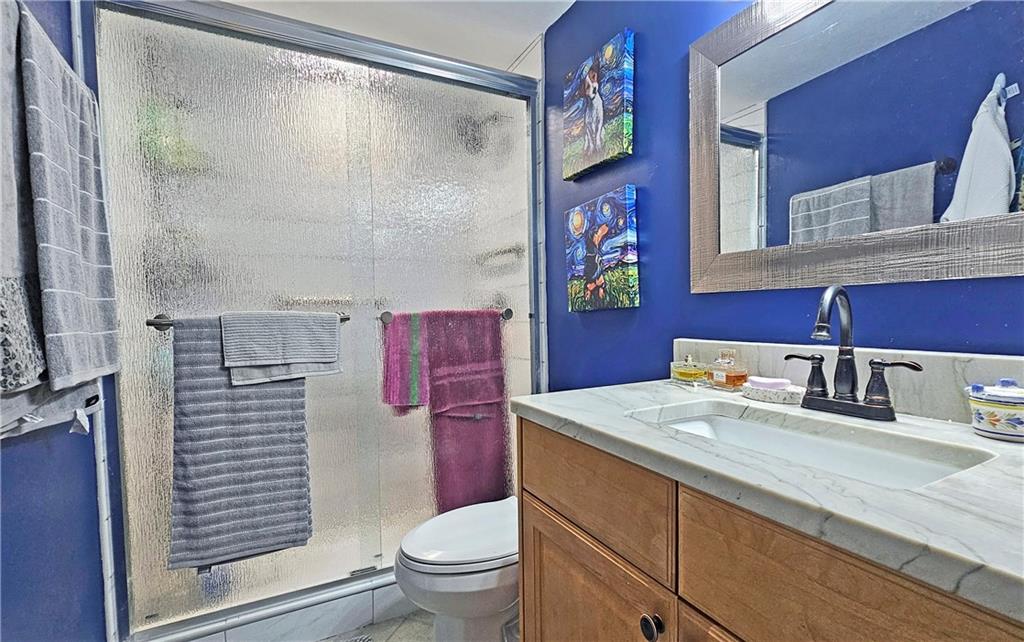 2825 Northeast Expressway, Unit E2 Atlanta, GA 30345 - Photo 7 of 15 a bathroom with a sink toilet and shower