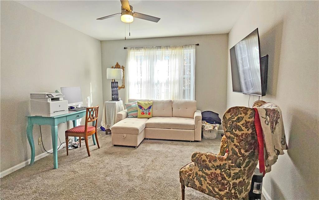 2825 Northeast Expressway, Unit E2 Atlanta, GA 30345 - Photo 8 of 15 a living room with furniture and a flat screen tv