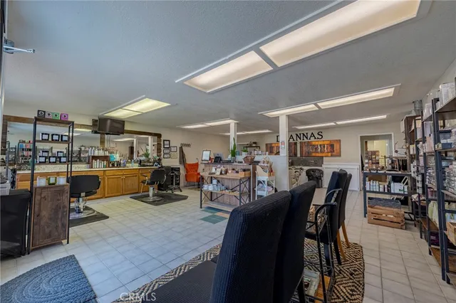 a kitchen with stainless steel appliances kitchen island granite countertop a sink and cabinets