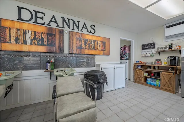 a bedroom with a walk in closet and a mirror