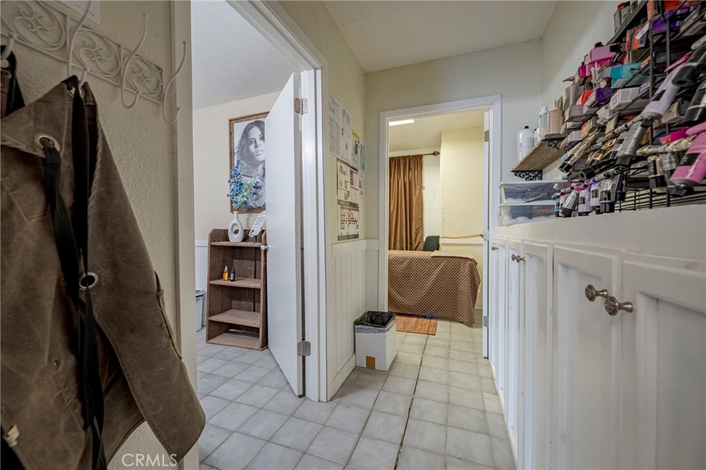 9387 Broadway Planada, CA 95365 - Photo 15 of 31 a bedroom with a walk in closet and a mirror