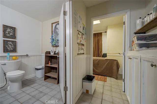 a bedroom with a bed and a table