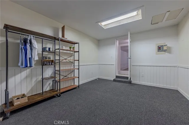 a bathroom with a toilet and a view of bathroom