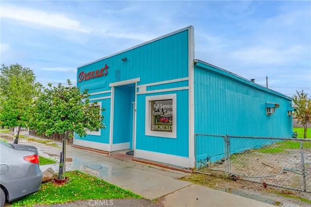 a front view of a building with garden