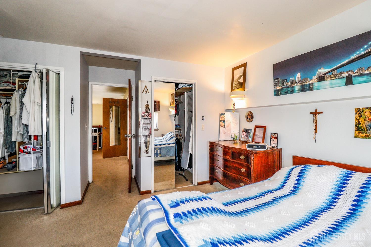 40 Fayette Street, Unit 57 Perth Amboy, NJ 08861 - Photo 26 of 33 a room with furniture and a view of bedroom