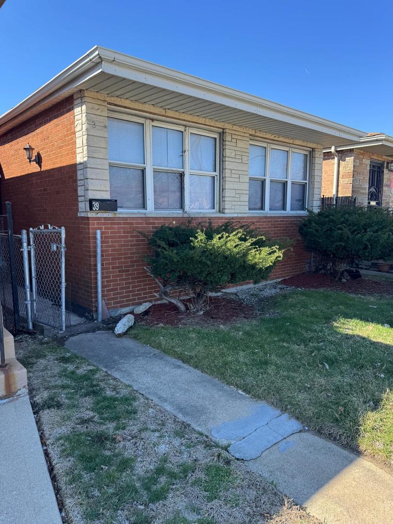 39 West 83rd Street Chicago, IL 60620 - Photo 2 of 12 a view of a house with a yard