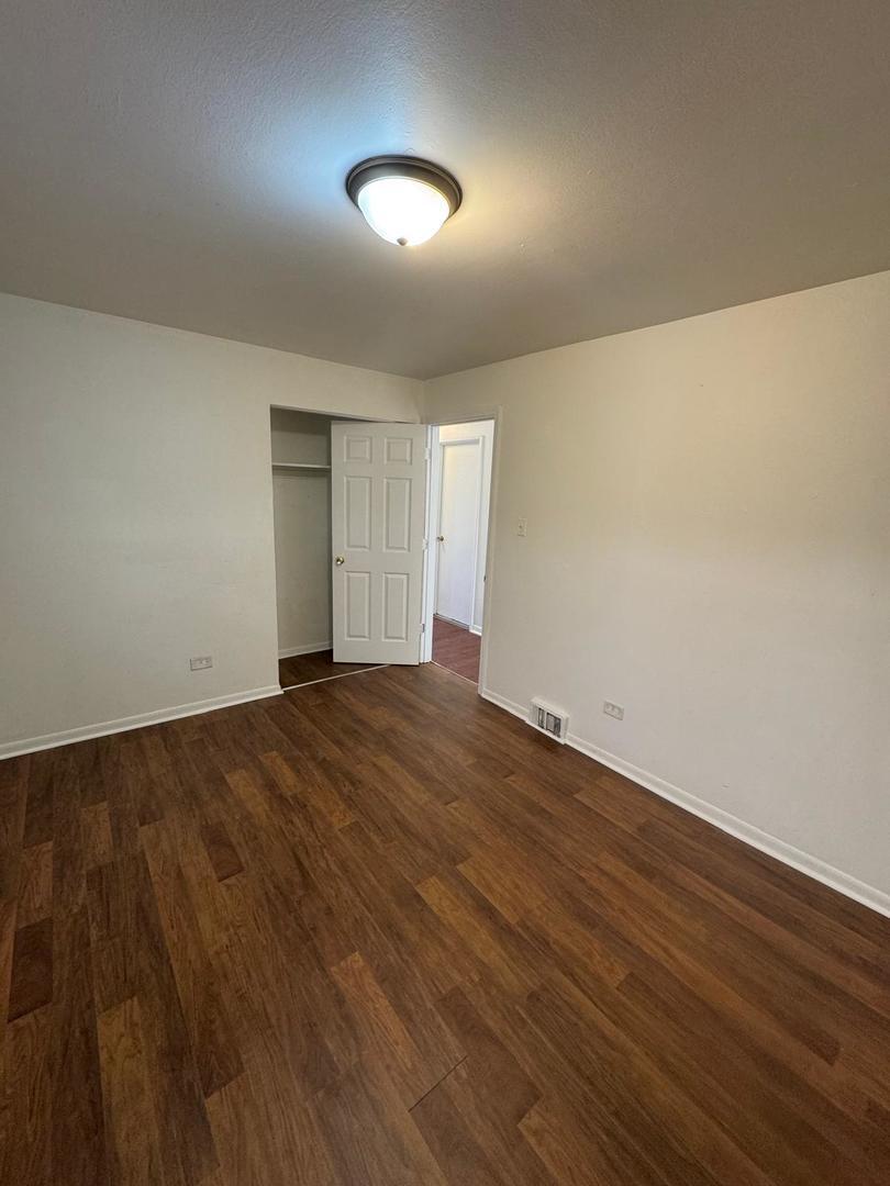 39 West 83rd Street Chicago, IL 60620 - Photo 6 of 12 a view of empty room with wooden floor