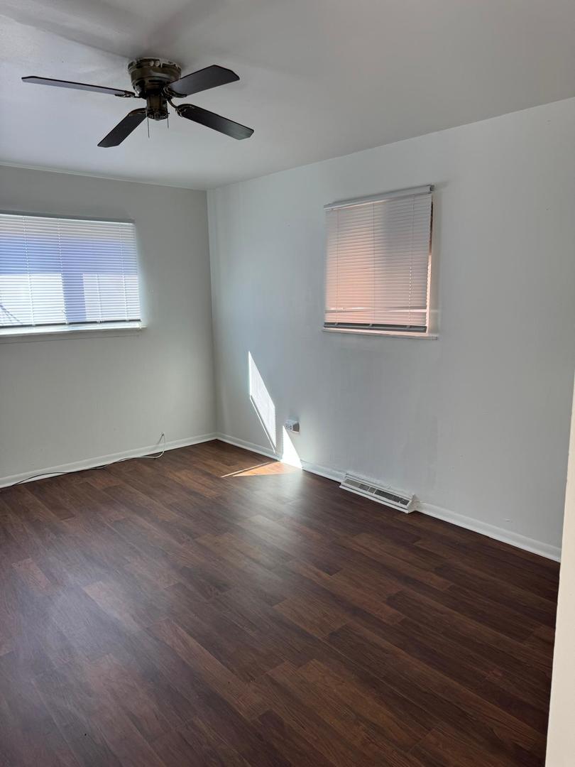 39 West 83rd Street Chicago, IL 60620 - Photo 8 of 12 a view of empty room with wooden floor and fan