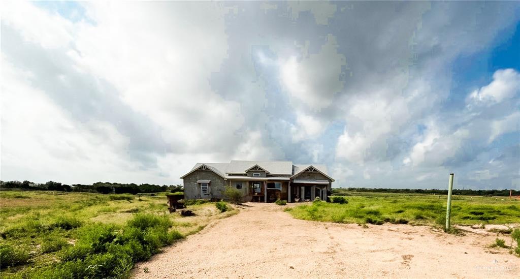 0 Brushline Road Edcouch, TX 78538 - Photo 8 of 17 a view of a big house with a big yard and large trees