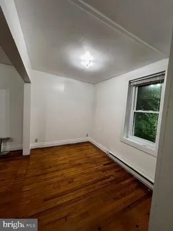 wooden floor and window in an empty room