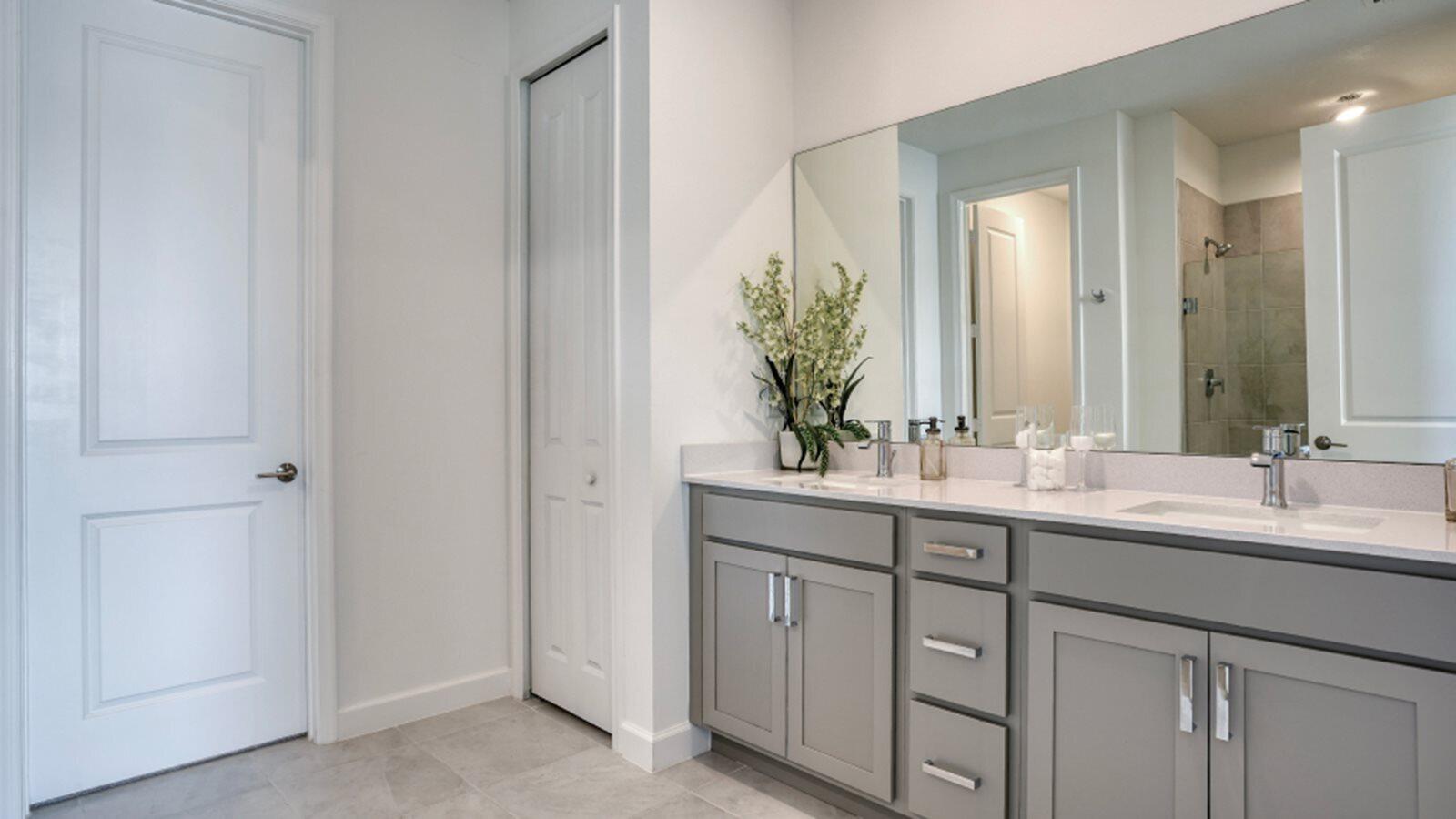 3611 Angler Drive Fort Pierce, FL 34946 - Photo 6 of 13 a bathroom with a double vanity sink and a mirror