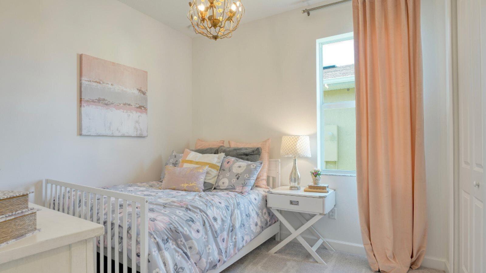 3611 Angler Drive Fort Pierce, FL 34946 - Photo 8 of 13 a bedroom with a bed and a chandelier