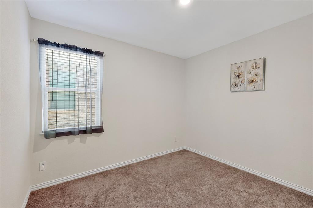 444 Ranchito Pass Fort Worth, TX 76052 - Photo 23 of 24 an empty room with a window