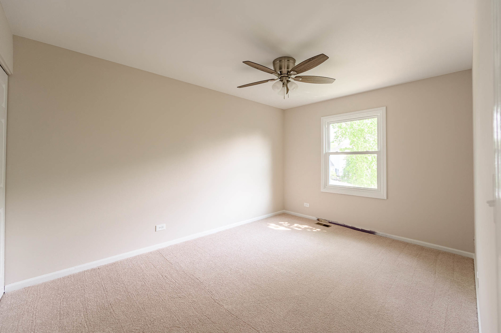 143 Hampton Street Cary, IL 60013 - Photo 11 of 19 a view of an empty room with a window