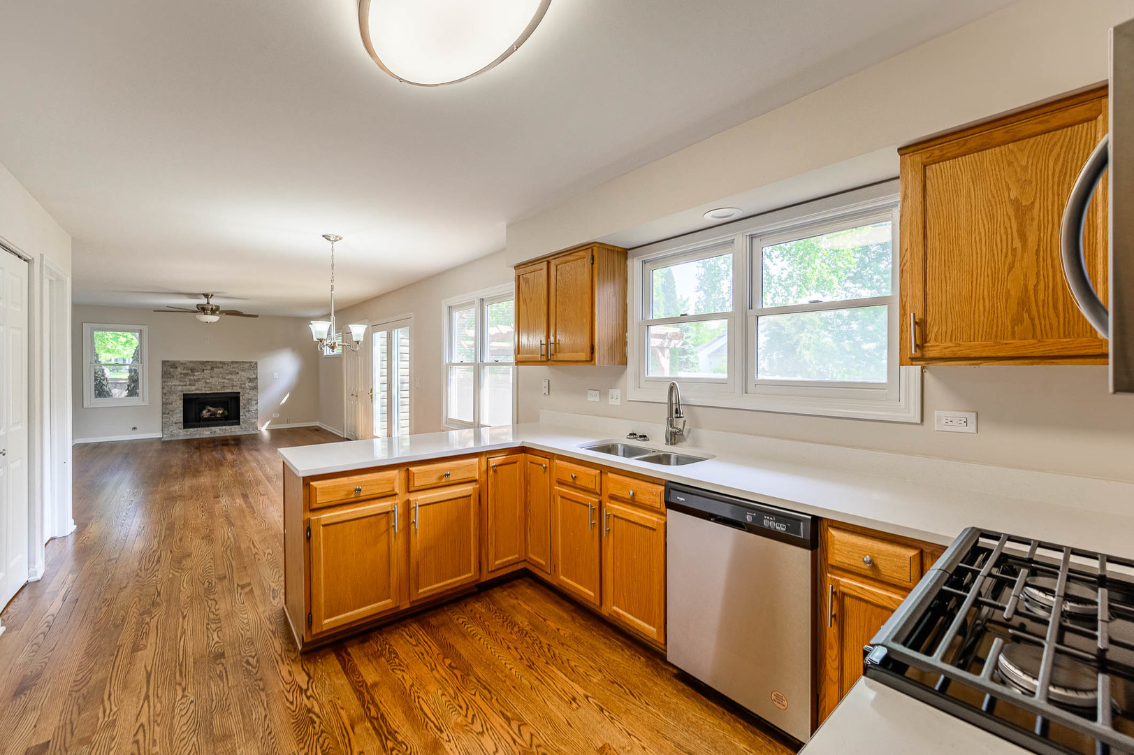 143 Hampton Street Cary, IL 60013 - Photo 5 of 19 a kitchen with stainless steel appliances granite countertop a sink stove and cabinets