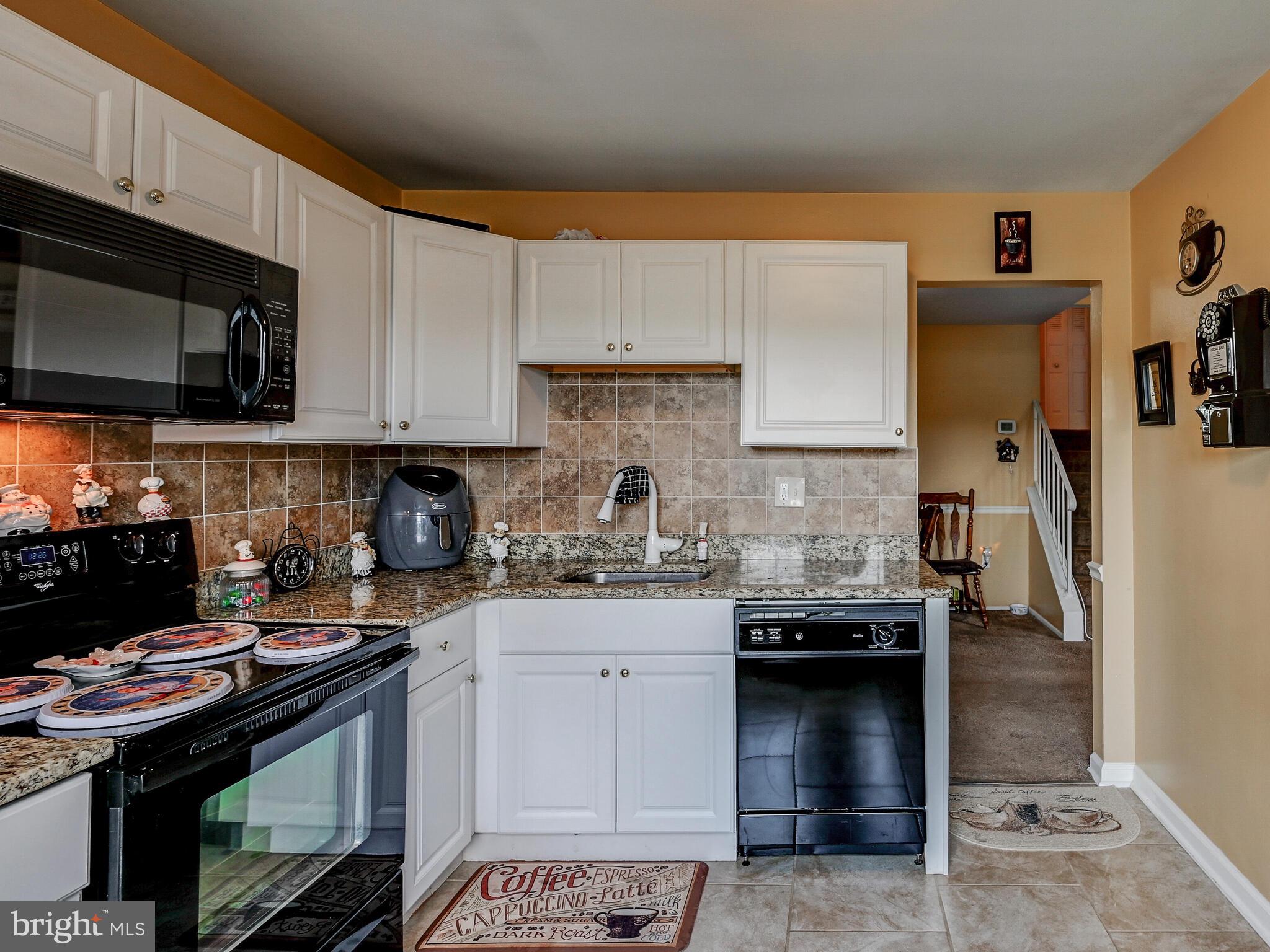 358 Laburnum Road Edgewood, MD 21040 - Photo 17 of 41 Granite countertops with matching backsplash.