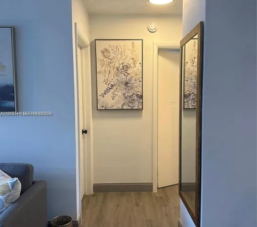 a view of front door with wooden floor