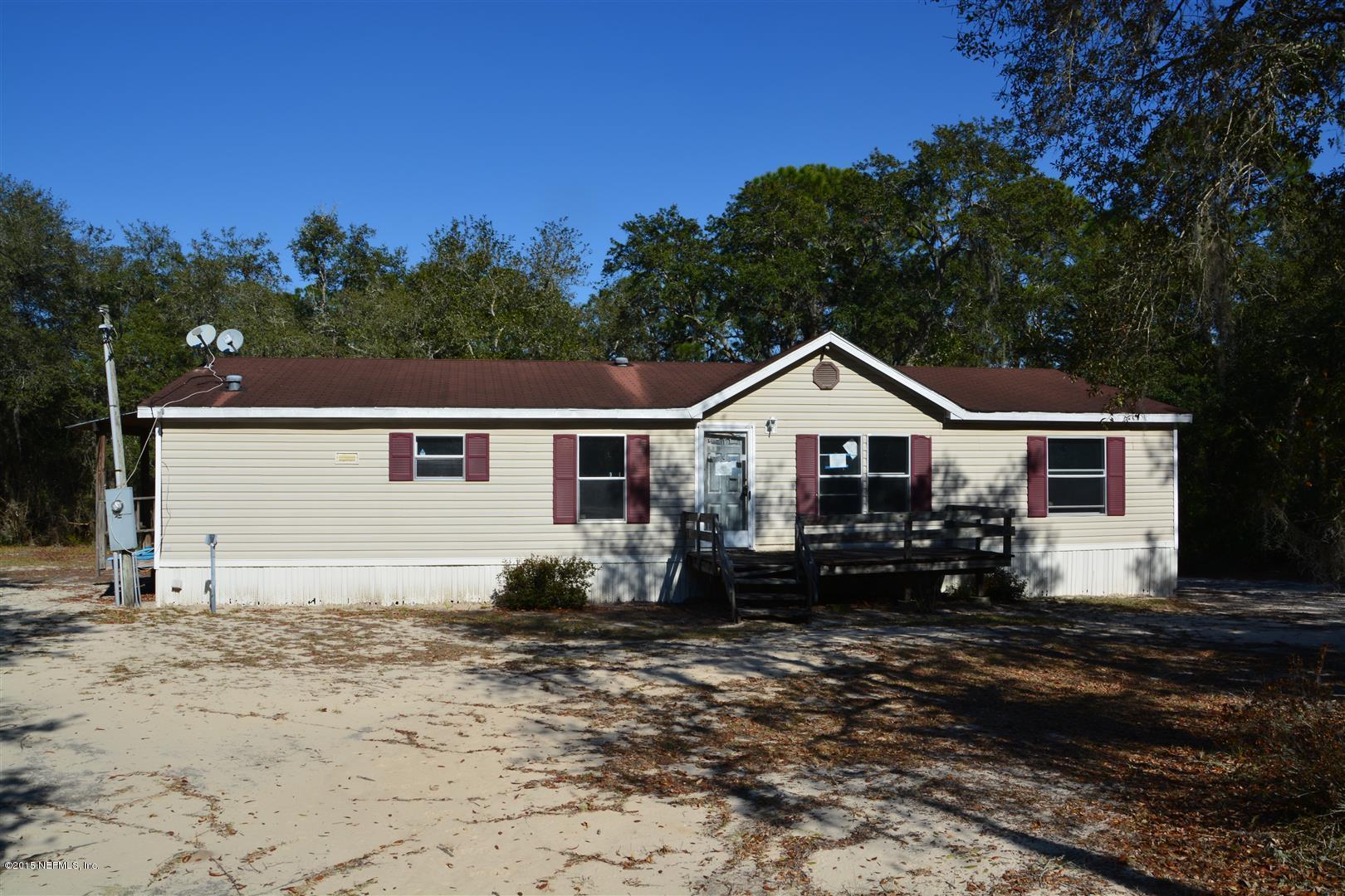 7463 Lilly Court Keystone Heights, FL 32656 - Photo 1 of 10 a front view of a house with a yard