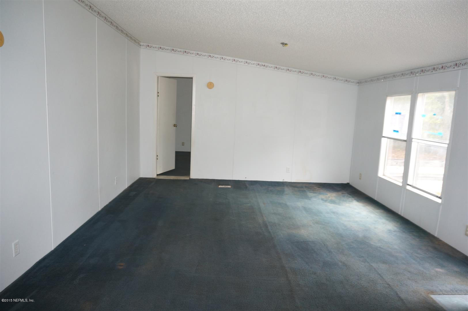 7463 Lilly Court Keystone Heights, FL 32656 - Photo 2 of 10 a view of an empty room with a window