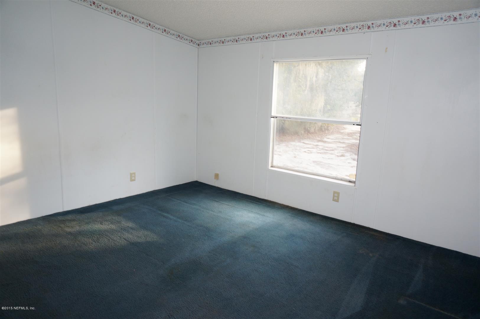 7463 Lilly Court Keystone Heights, FL 32656 - Photo 7 of 10 an empty room with a window