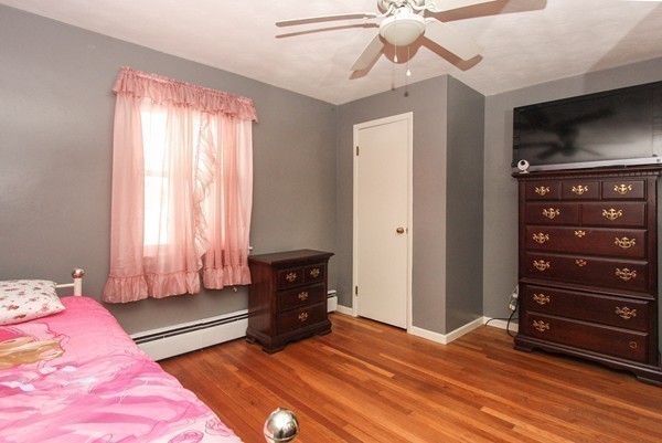 282 Hartwick Street Springfield, MA 01108 - Photo 17 of 23 a bedroom with a bed and a television