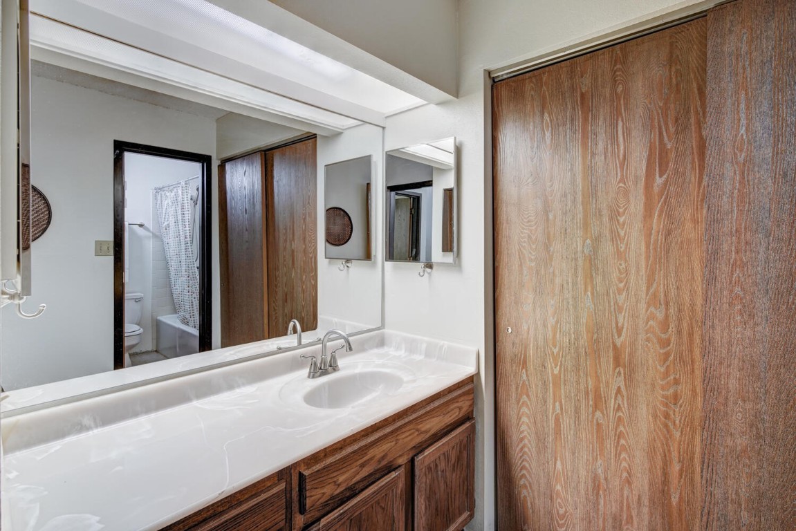 745 Columbine Road, Unit A404 Breckenridge, CO 80424 - Photo 15 of 32 a bathroom with a granite countertop sink and a mirror