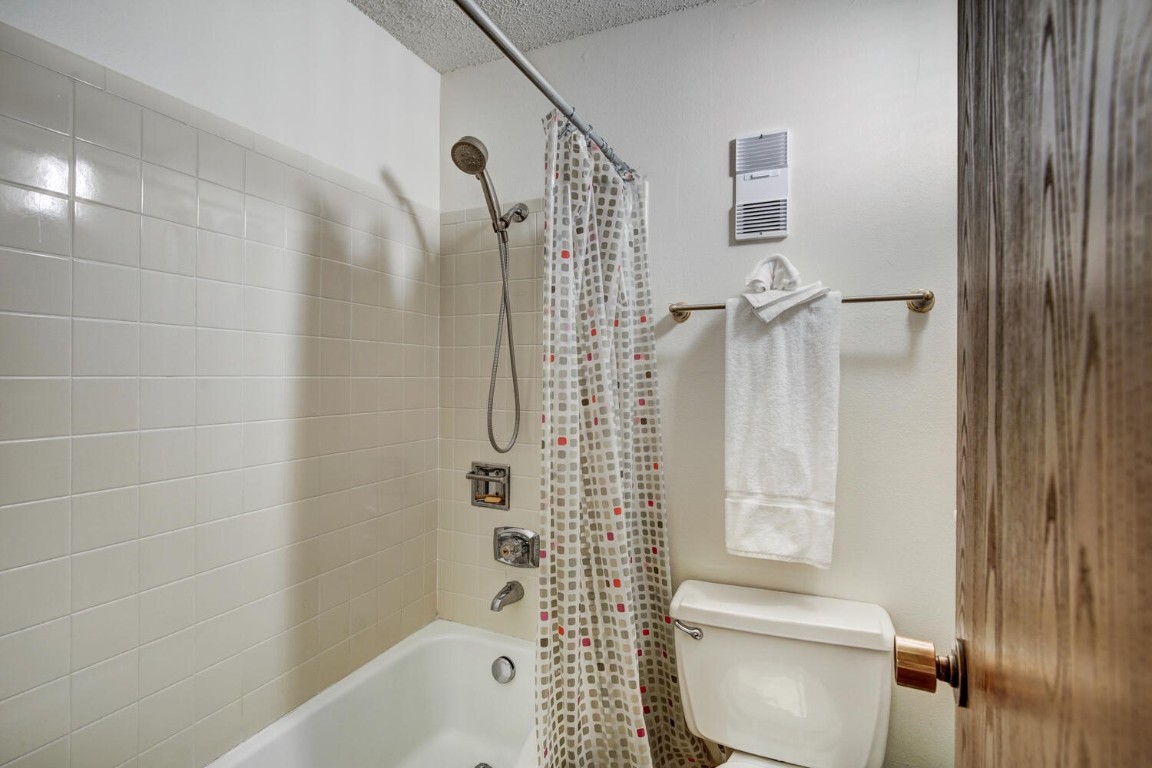745 Columbine Road, Unit A404 Breckenridge, CO 80424 - Photo 17 of 32 a bathroom with a shower and a toilet