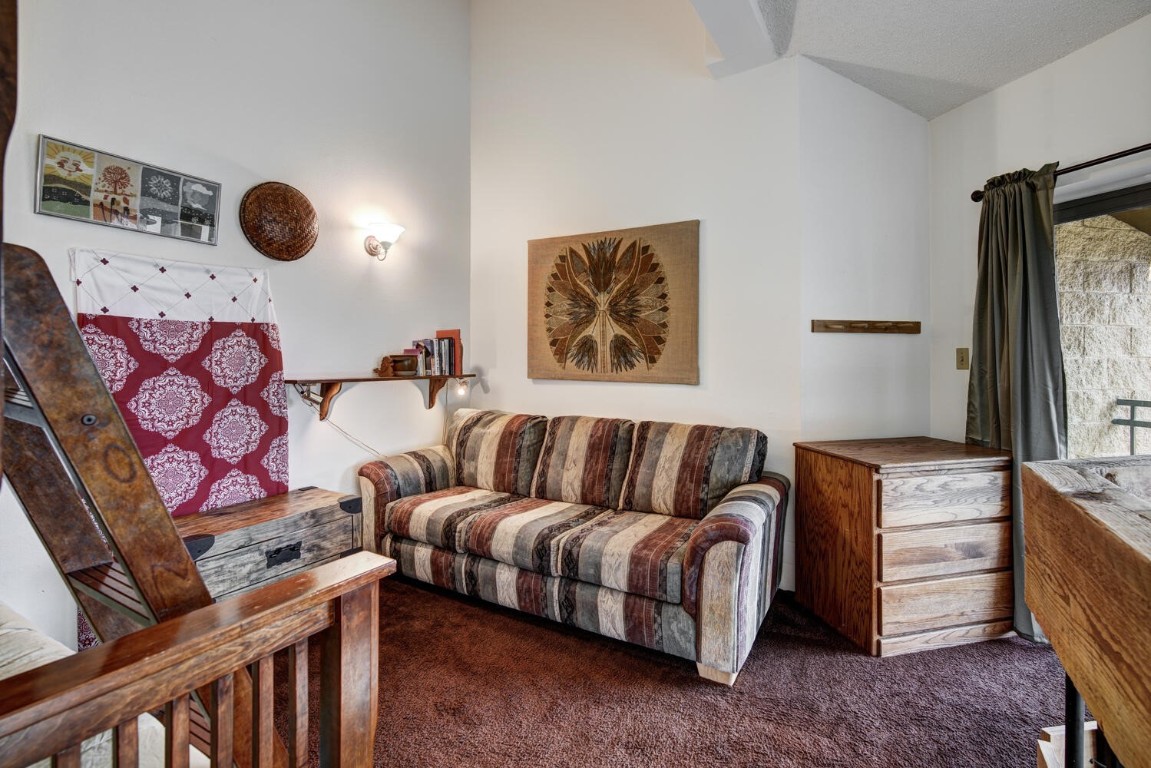 745 Columbine Road, Unit A404 Breckenridge, CO 80424 - Photo 19 of 32 a living room with furniture and a window