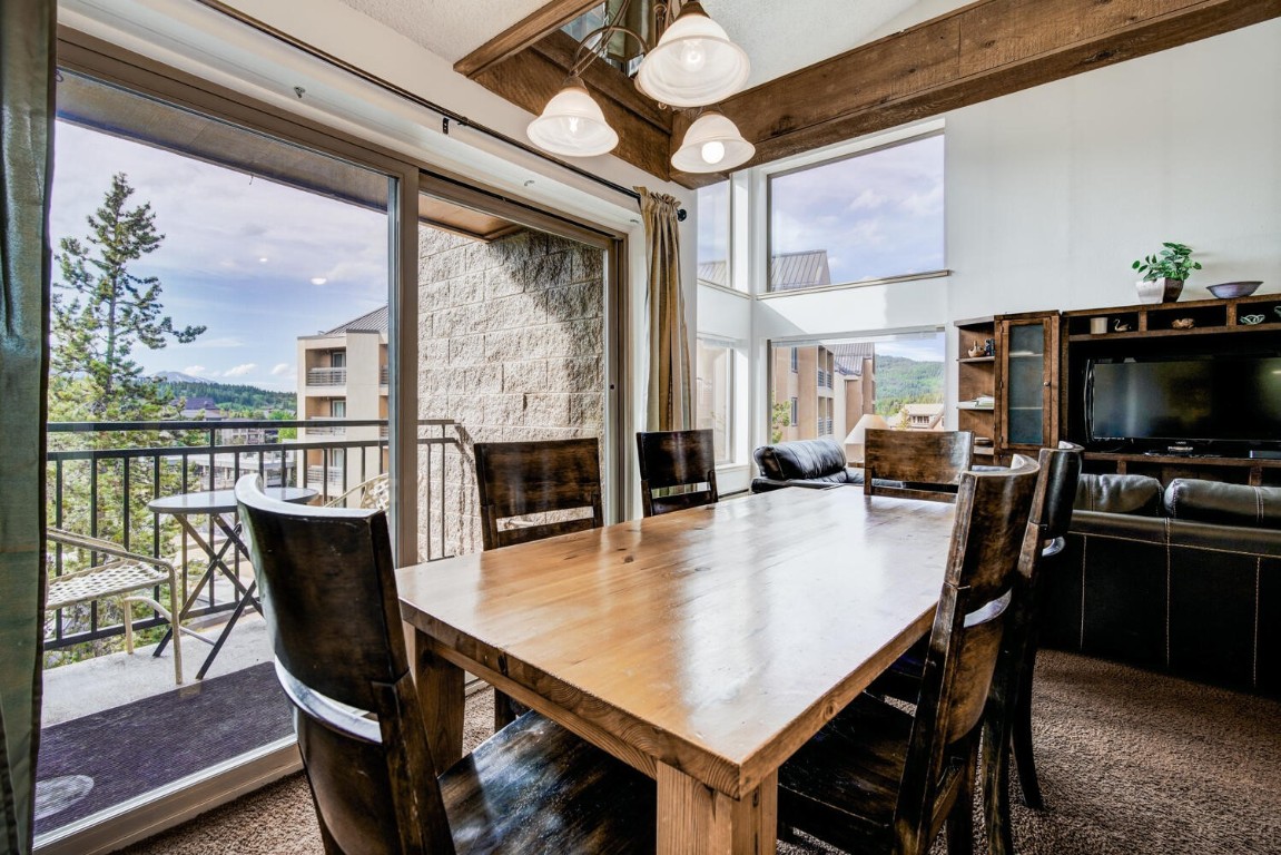 745 Columbine Road, Unit A404 Breckenridge, CO 80424 - Photo 2 of 32 a view of a dining room with furniture window and wooden floor