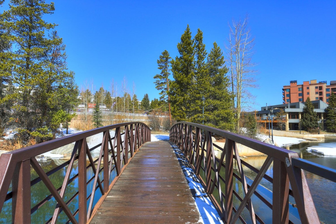 745 Columbine Road, Unit A404 Breckenridge, CO 80424 - Photo 30 of 32 a balcony with wooden floor and city view