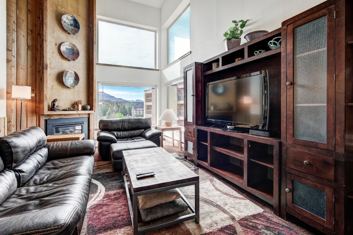 745 Columbine Road, Unit A404 Breckenridge, CO 80424 - Photo 7 of 32 a living room with furniture and a flat screen tv