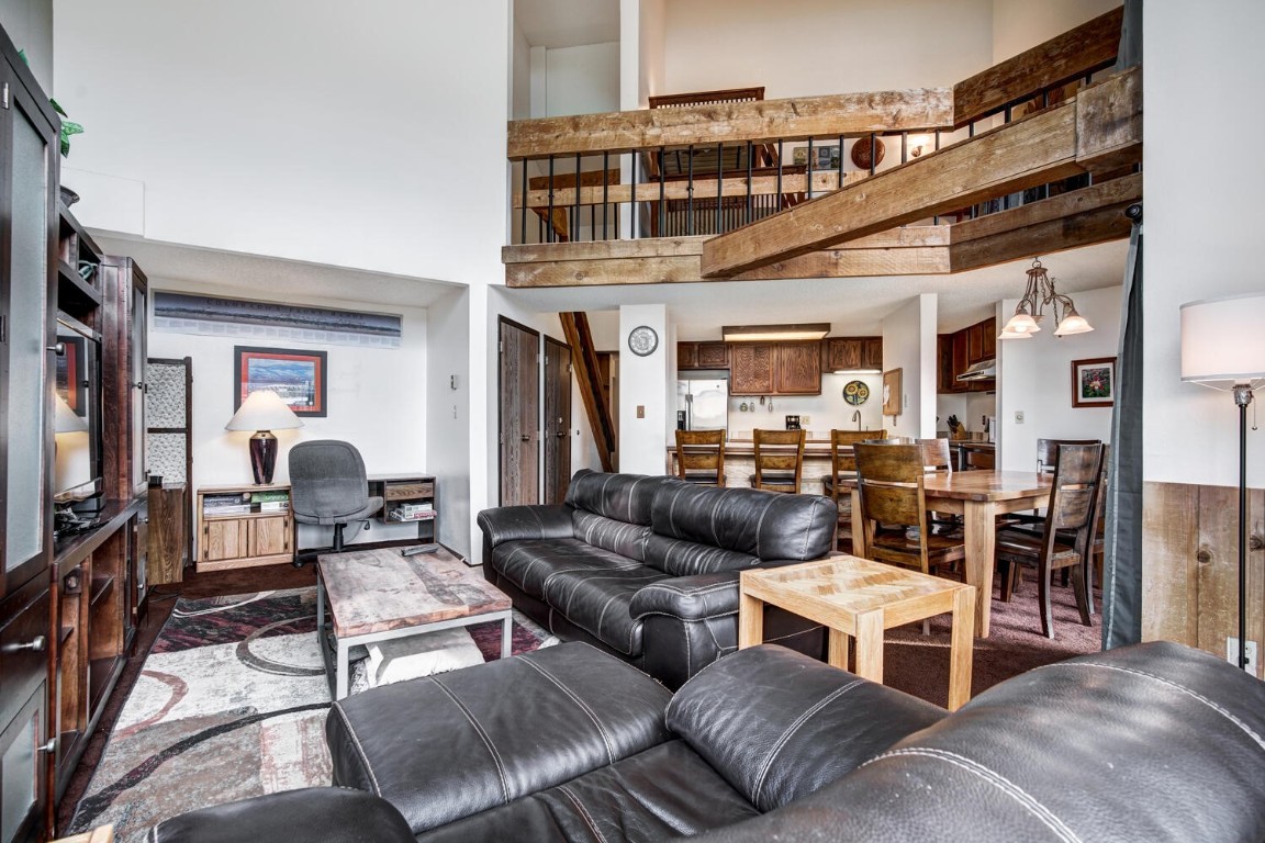 745 Columbine Road, Unit A404 Breckenridge, CO 80424 - Photo 8 of 32 a living room with furniture and a flat screen tv
