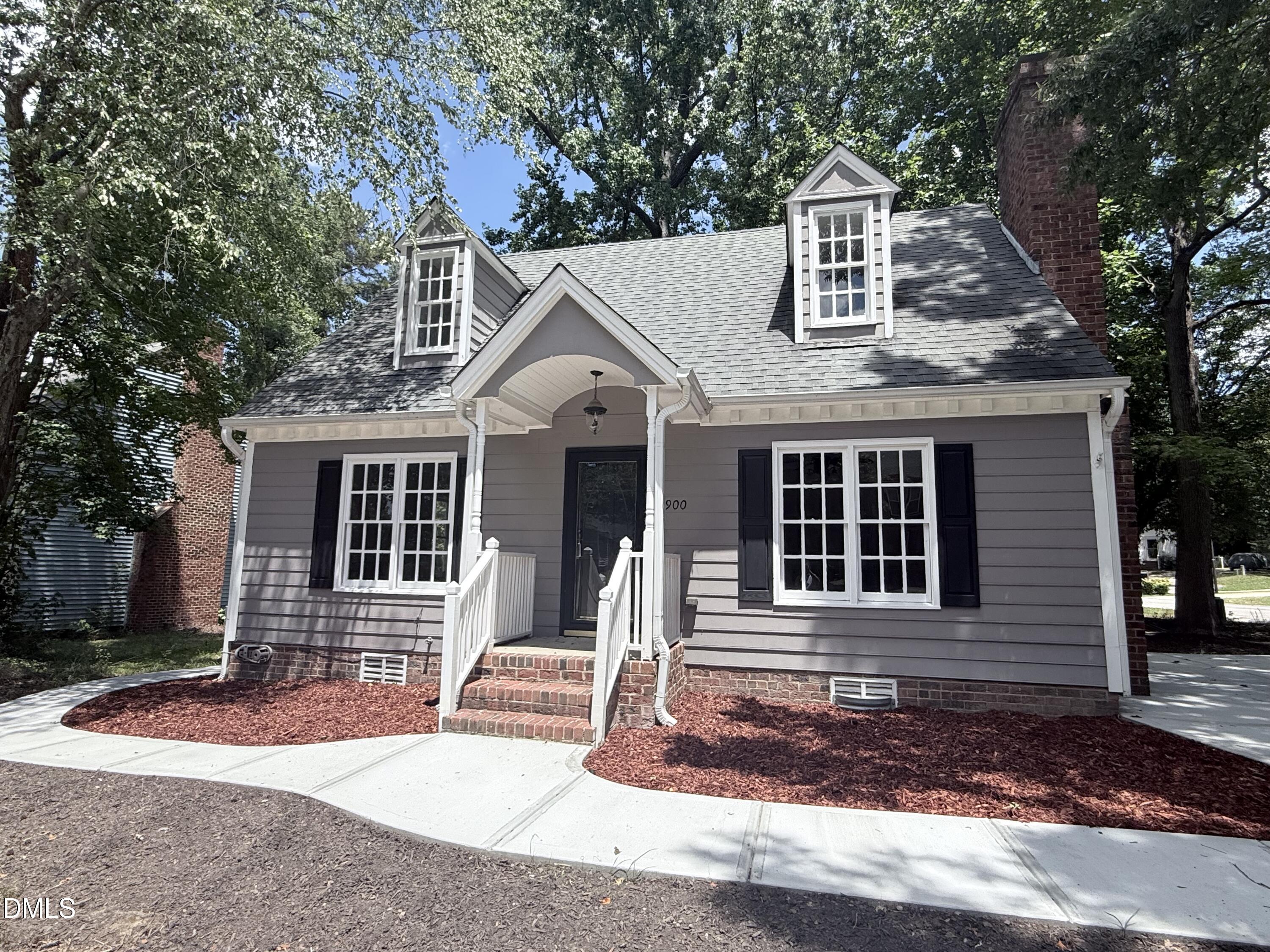 2900 Broadlands Drive Raleigh, NC 27604 - Photo 2 of 60 a front view of a house with a yard