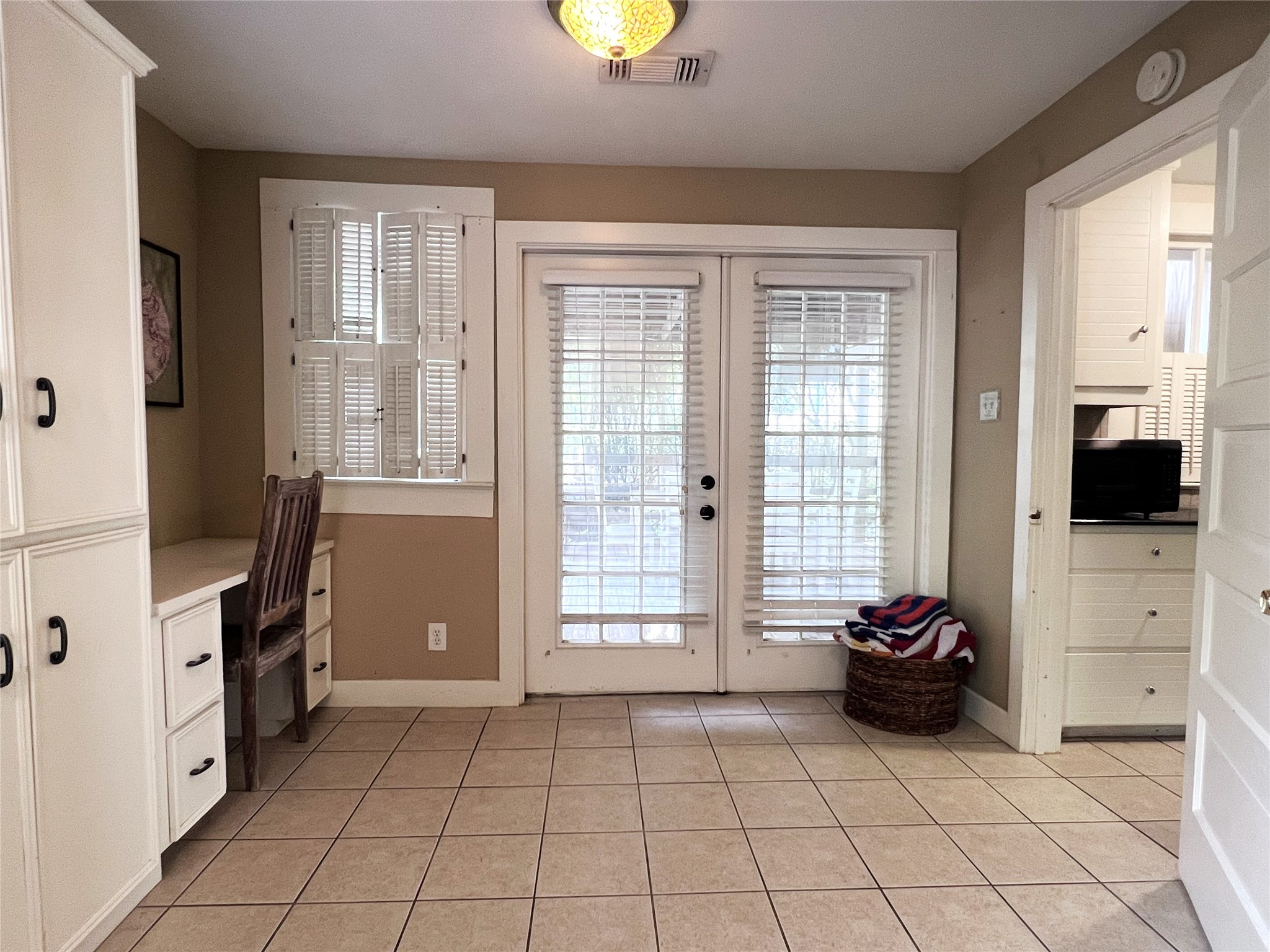 606 Sycamore Street Brenham, TX 77833 - Photo 19 of 27 a view of an empty room with a fireplace and a window