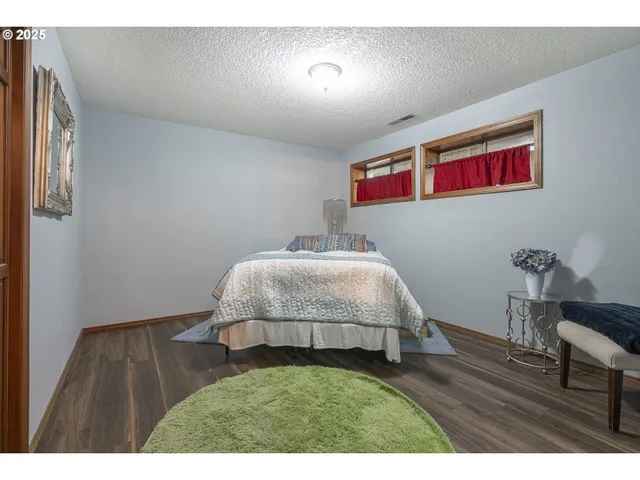 a bedroom with a bed and a table in it