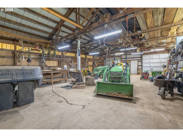 a living room with furniture and a kitchen