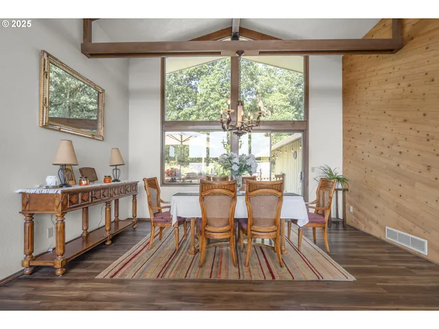 a view of a dining room with furniture window and outside view