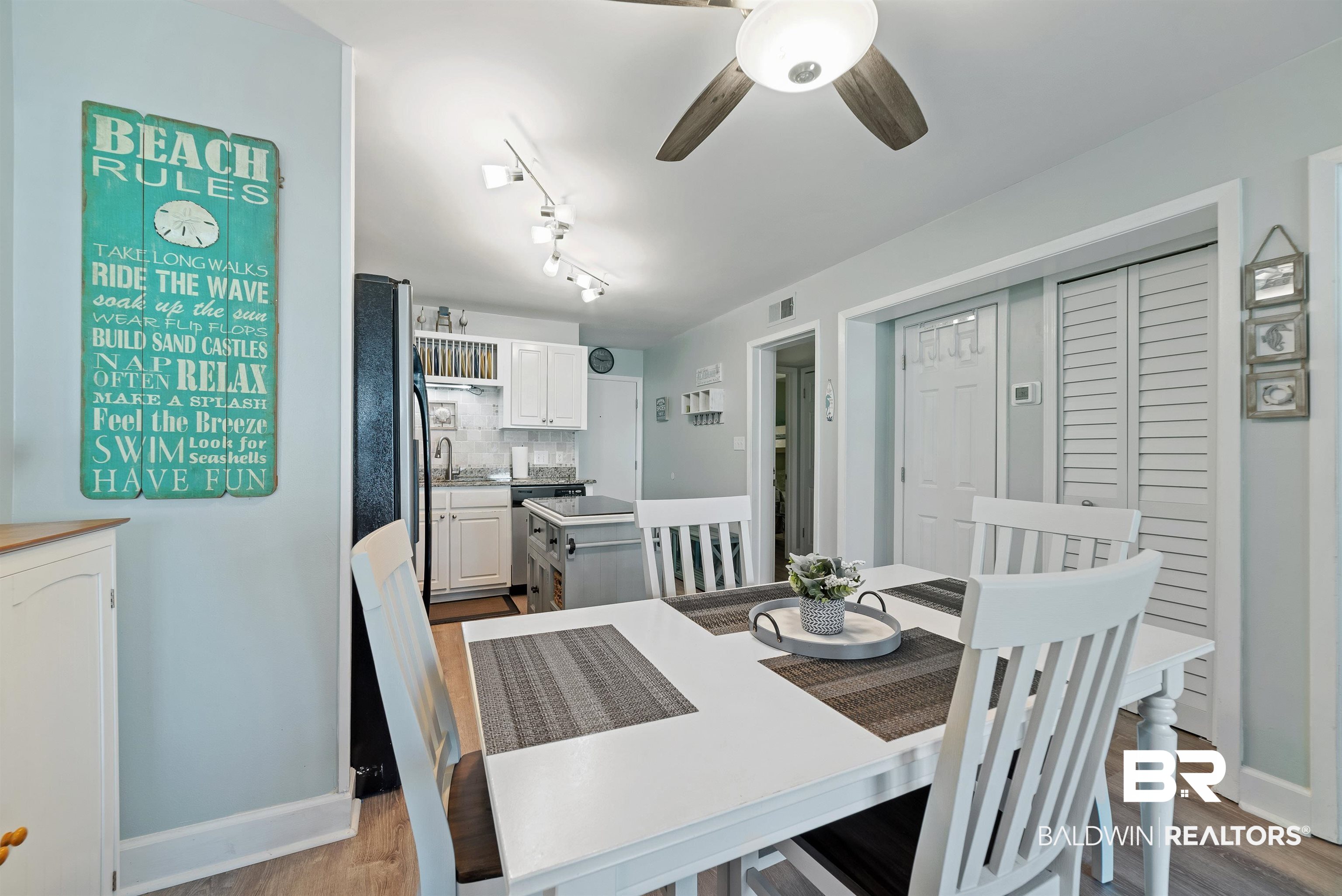 400 Plantation Road, Unit 2123 Gulf Shores, AL 36542 - Photo 11 of 44 Dining room featuring wood-type flooring, ceiling fan, and track lighting