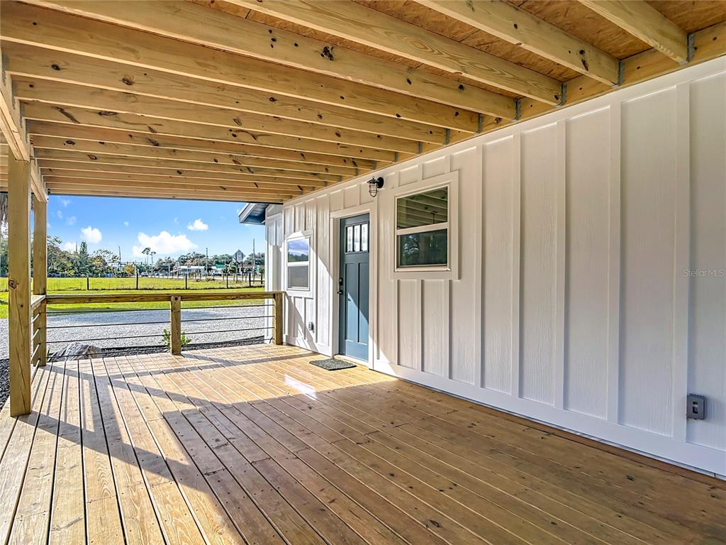 379 State Rte 415 Osteen, FL 32764 - Photo 14 of 48 a view of swimming pool with wooden floor and seating space